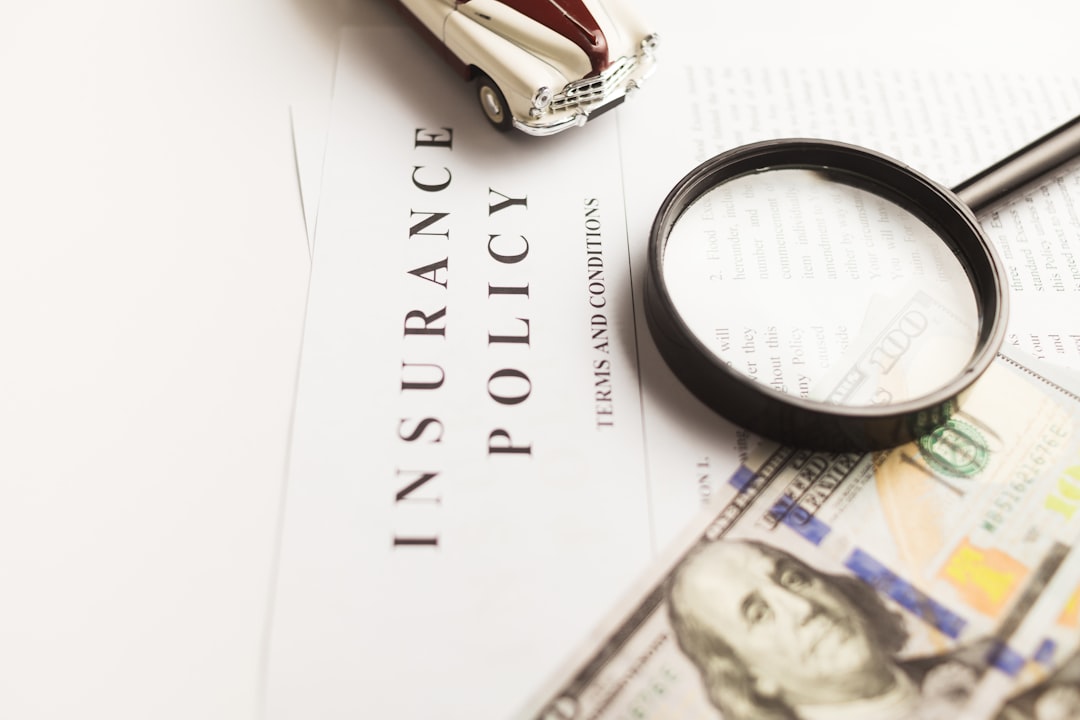 Home Certificate of motor insurance and policy with car and dollar bills.